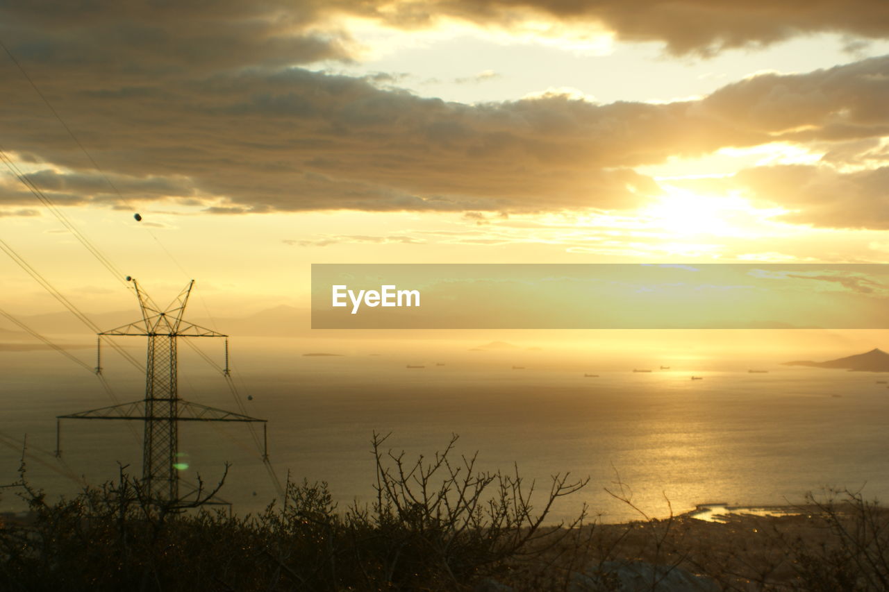 SCENIC VIEW OF SUNSET OVER SEA