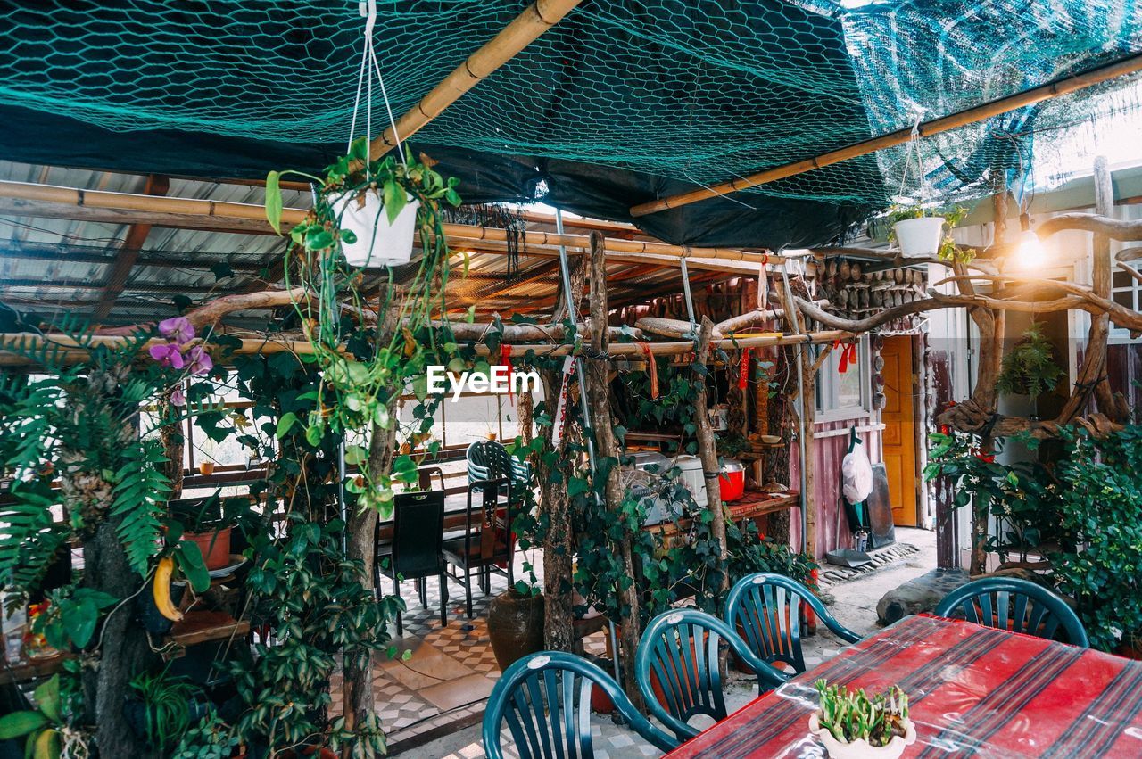 View of empty chairs and tables in at cafe