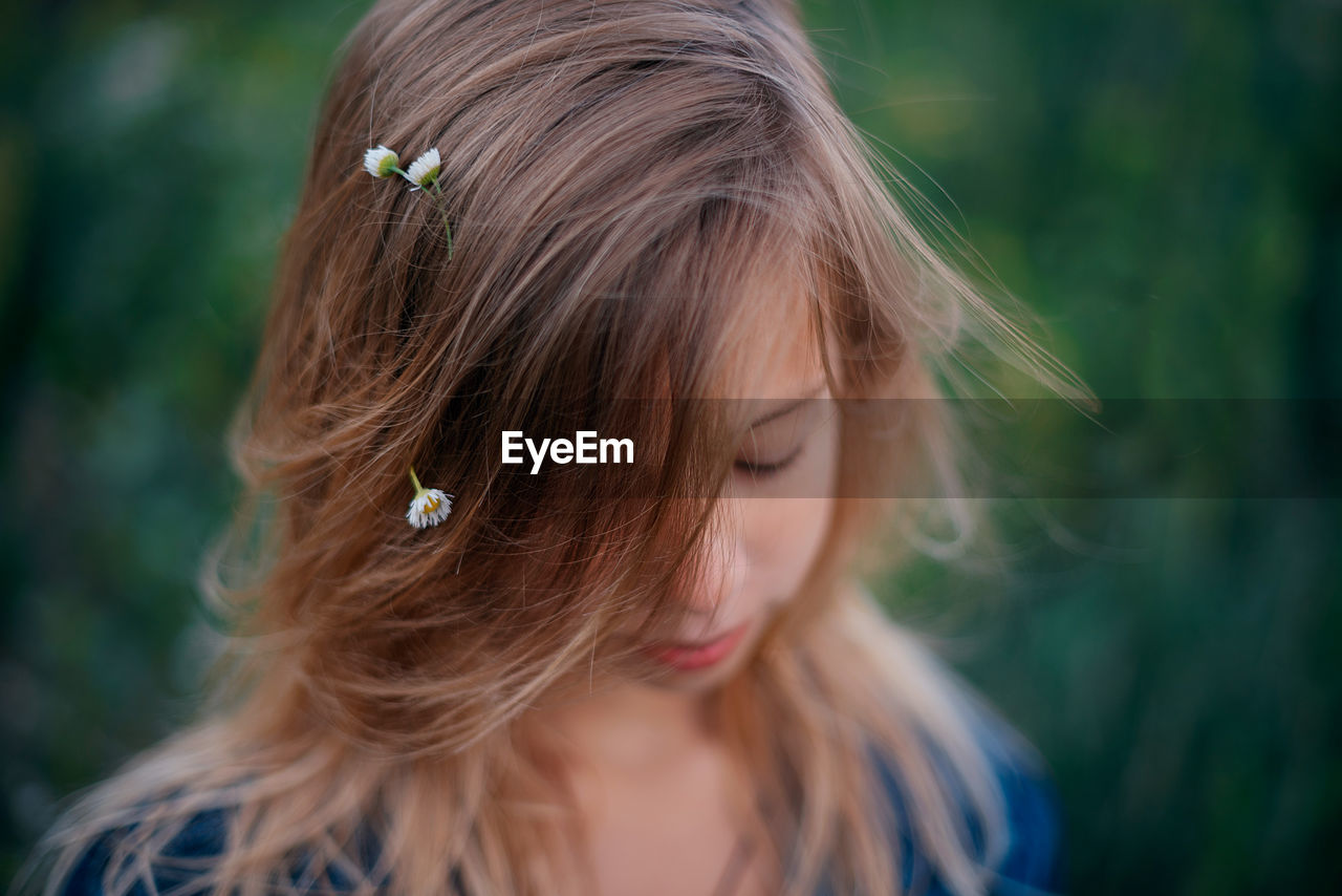 Close-up of young woman looking away