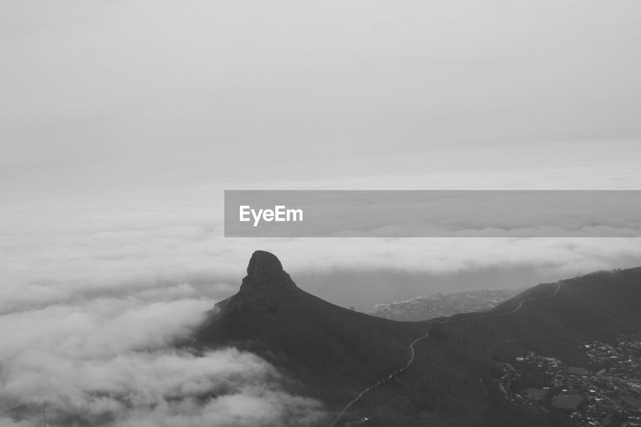 Scenic view of mountains against cloudy sky