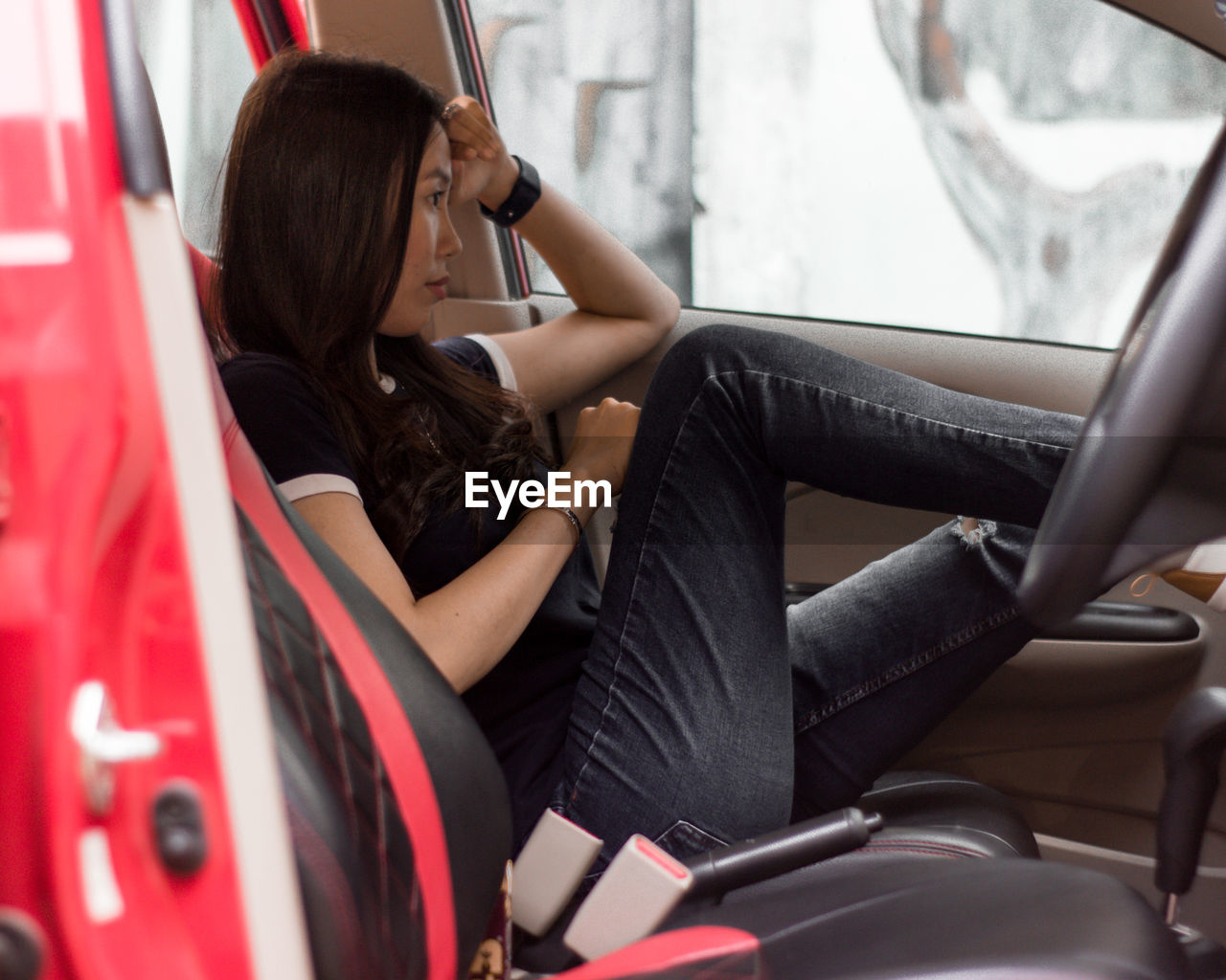 Woman sitting in car