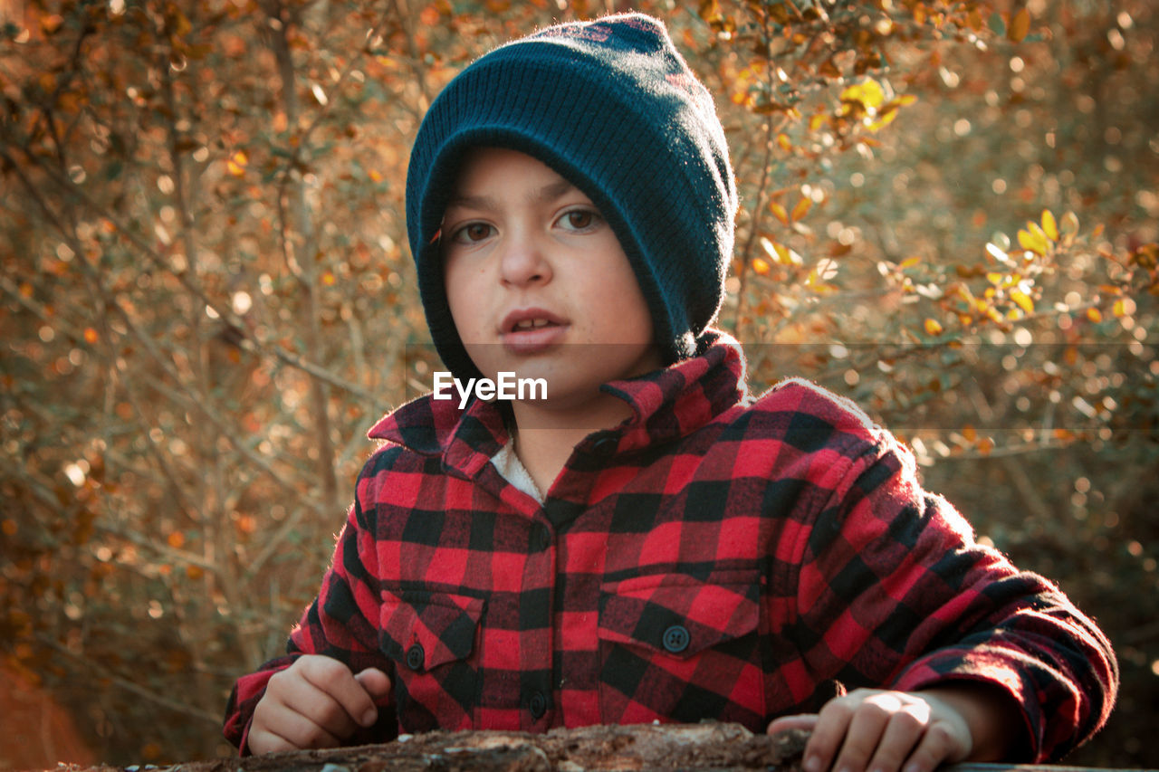 Young boy enjoying the outdoors in a candid shot while playing. 