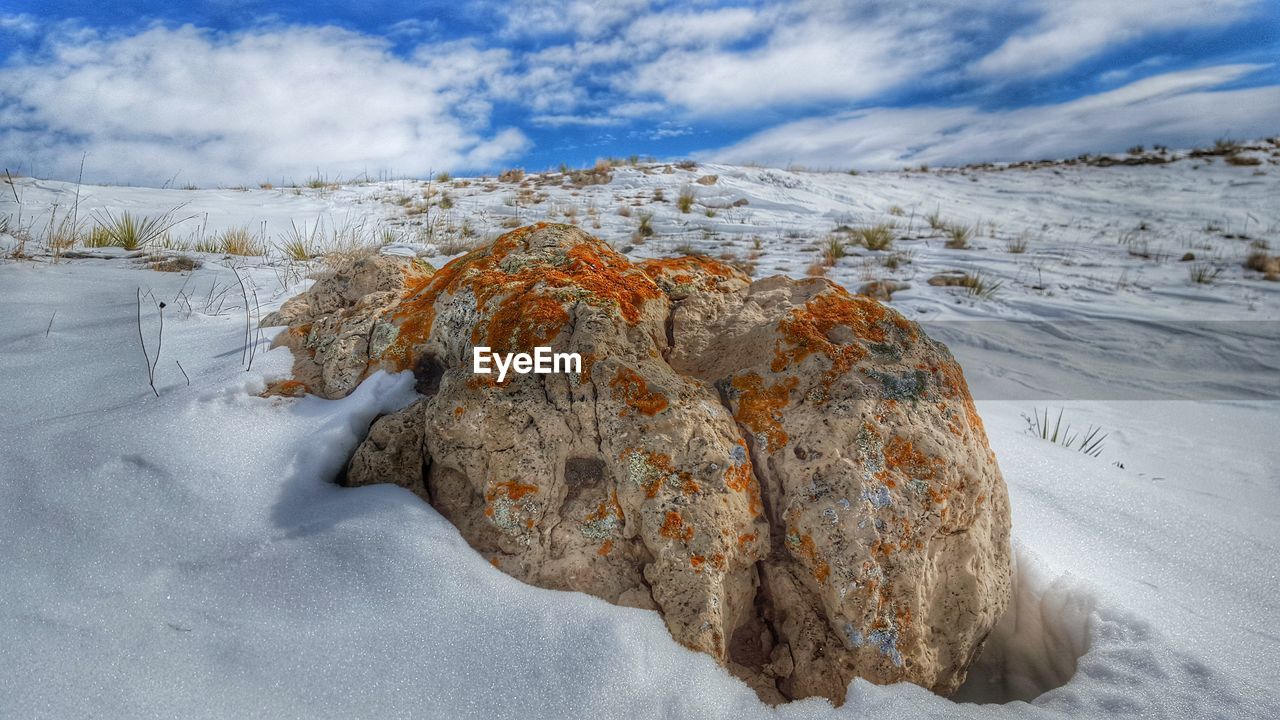 Rocks at snow covered pawnee national grassland against sky
