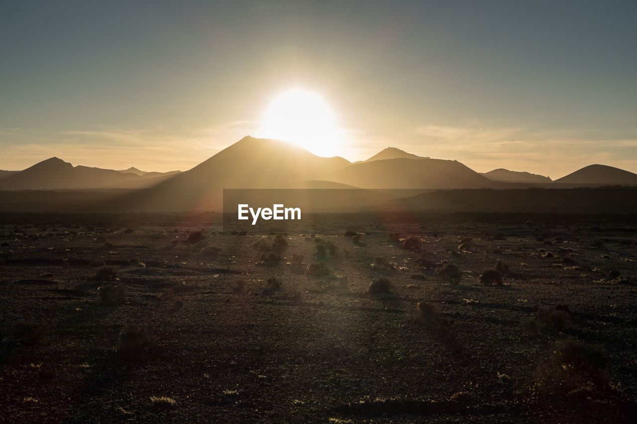 SUNSET OVER MOUNTAINS