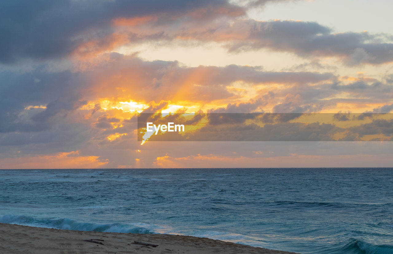 Scenic view of sea against sky during sunset