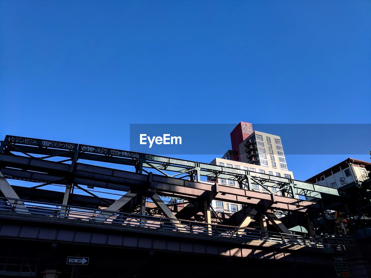 LOW ANGLE VIEW OF BUILDING AGAINST BLUE SKY