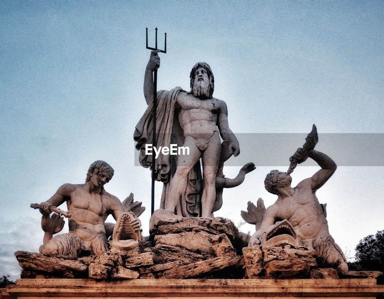 Low angle view of statue against sky