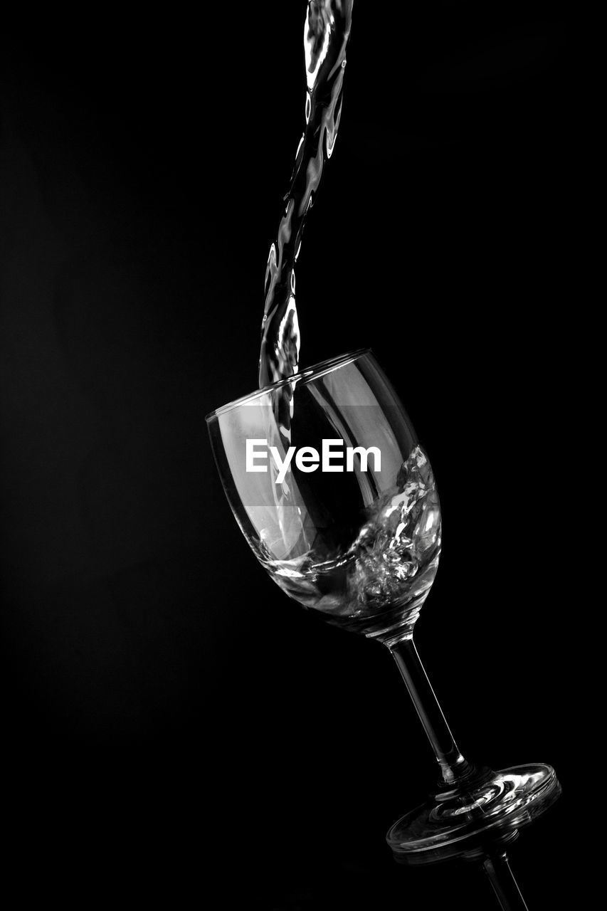 CLOSE-UP OF ELECTRIC LAMP OVER BLACK BACKGROUND