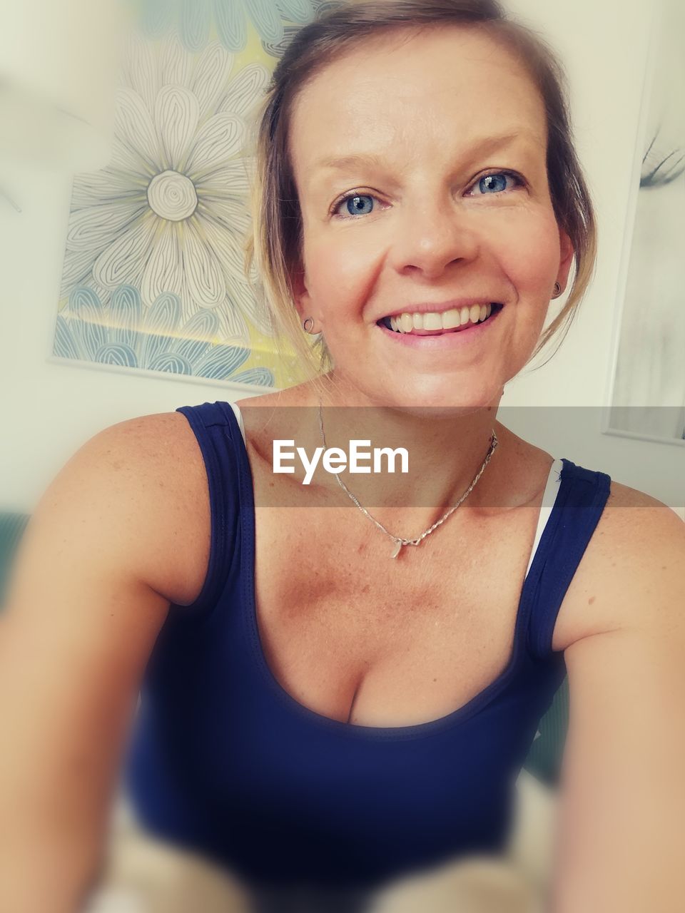 Portrait of smiling woman at home