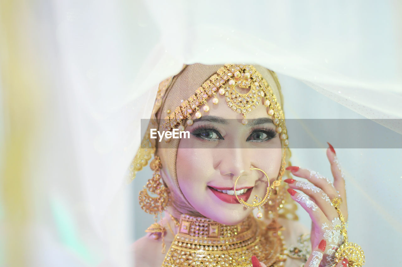 The beautiful and attractive indonesian version of india's face photo, at a party.