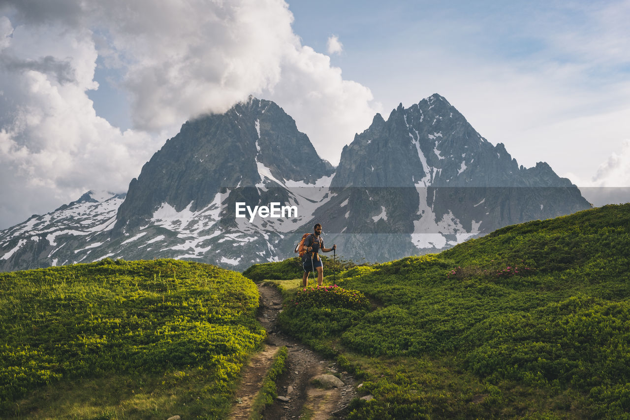 Young male hikes to aiguillette des posettes, french alps, chamonix.