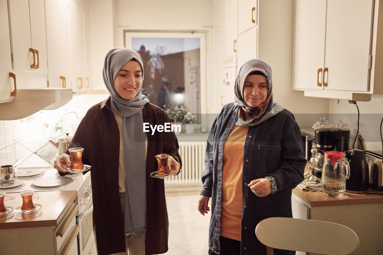 Women preparing evening tea at home