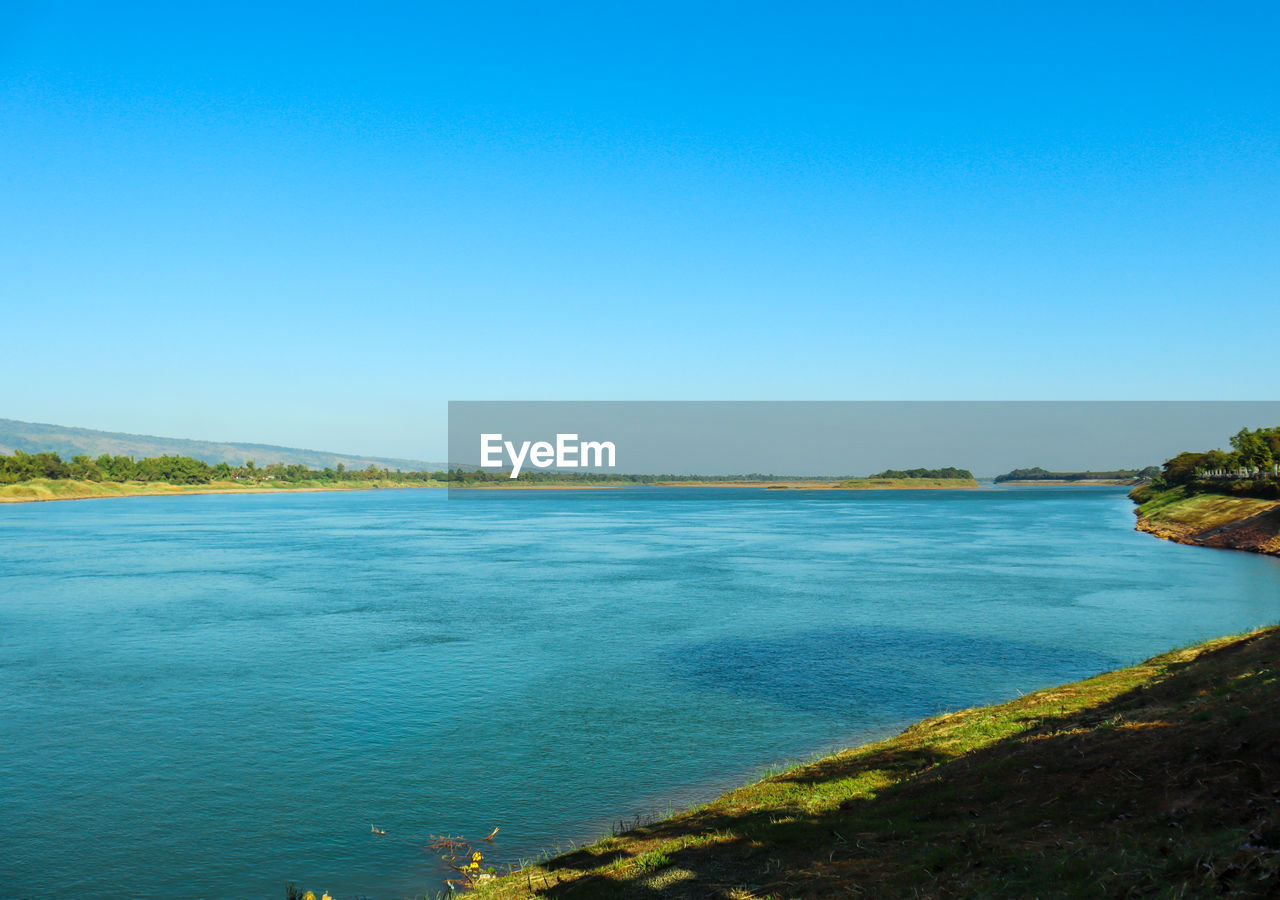 SCENIC VIEW OF SEA AGAINST BLUE SKY