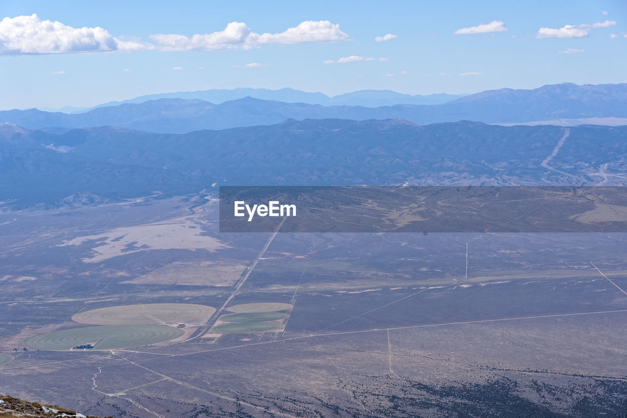 HIGH ANGLE VIEW OF LANDSCAPE AND MOUNTAINS AGAINST SKY