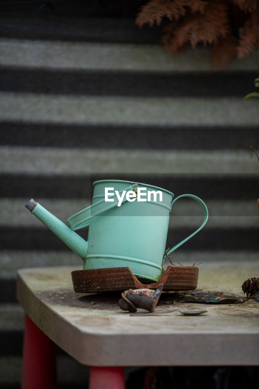 wood, food and drink, no people, table, cup, iron, green, drink, mug, nature, still life, food, plant, outdoors, teapot, still life photography, lighting, tableware, hot drink, kitchen utensil, day, coffee cup