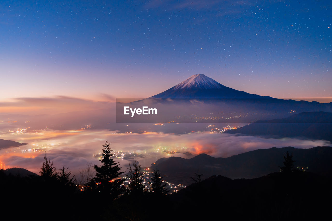 Scenic view of mountains against sky during sunset