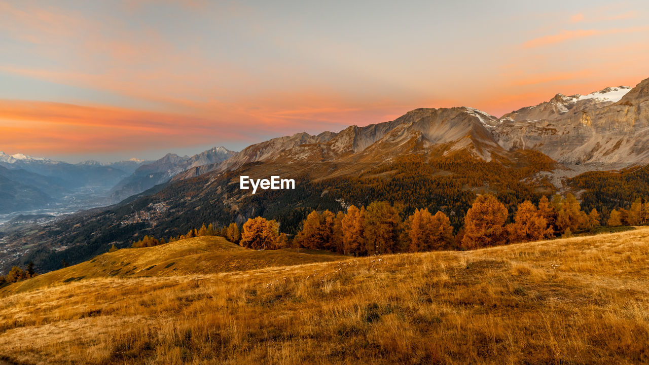 Scenic view of mountains against sky during sunset