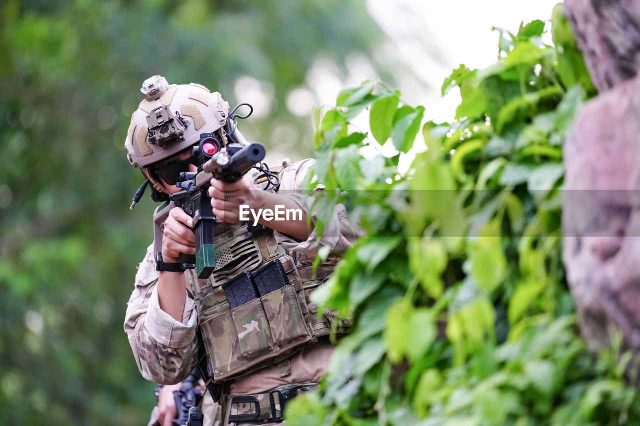 adult, nature, men, plant, outdoors, person, tree, forest, activity, one person, protection, sports, day, land, camouflage clothing, clothing