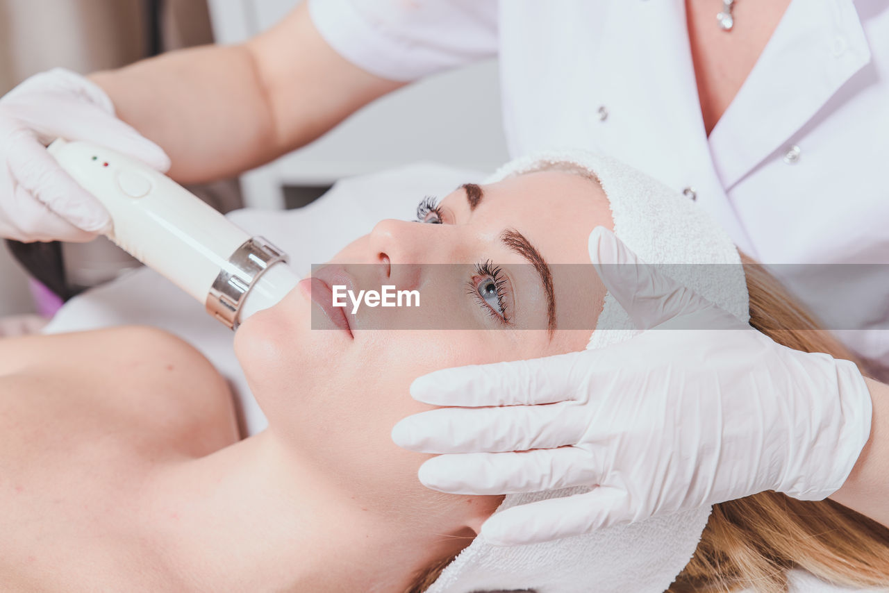 Close-up of woman getting facial beauty treatment