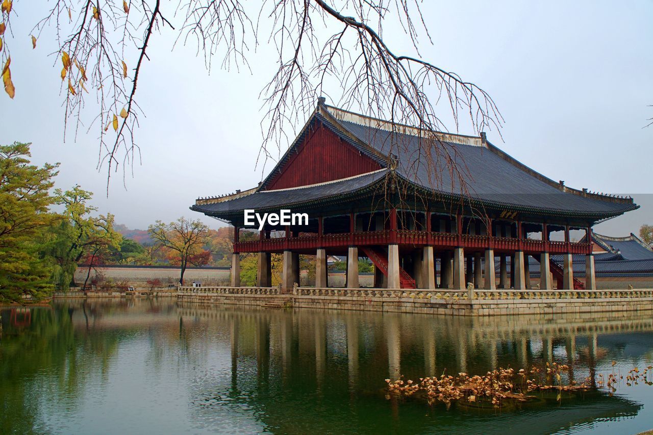 GAZEBO BY LAKE AGAINST SKY