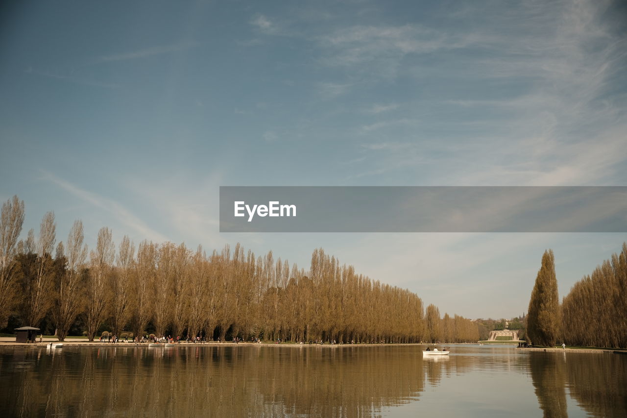 reflection, water, tree, nature, sky, morning, lake, beauty in nature, scenics - nature, tranquility, plant, tranquil scene, cloud, dawn, sunlight, landscape, no people, autumn, forest, non-urban scene, body of water, idyllic, winter, environment, land, outdoors, day, remote, waterfront, mountain
