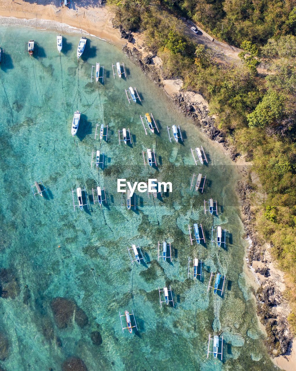 Aerial view of boats docked in a bay in bali, indonesia