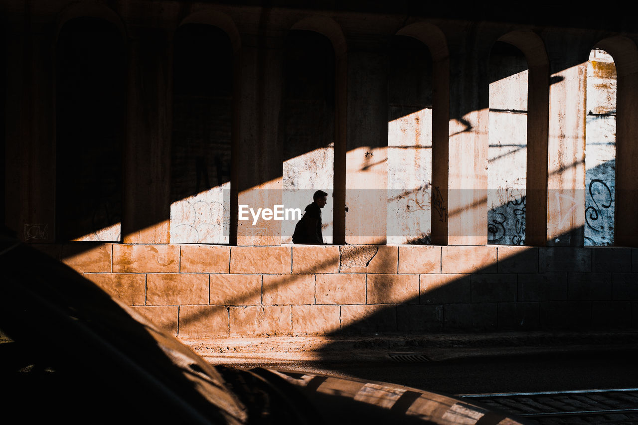 Silhouette of person on street