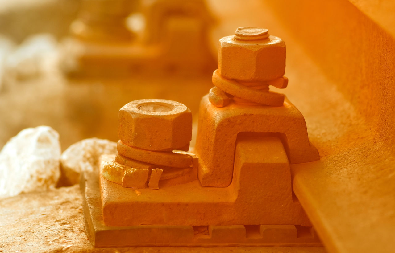 Close-up of nut and bolt on railroad track