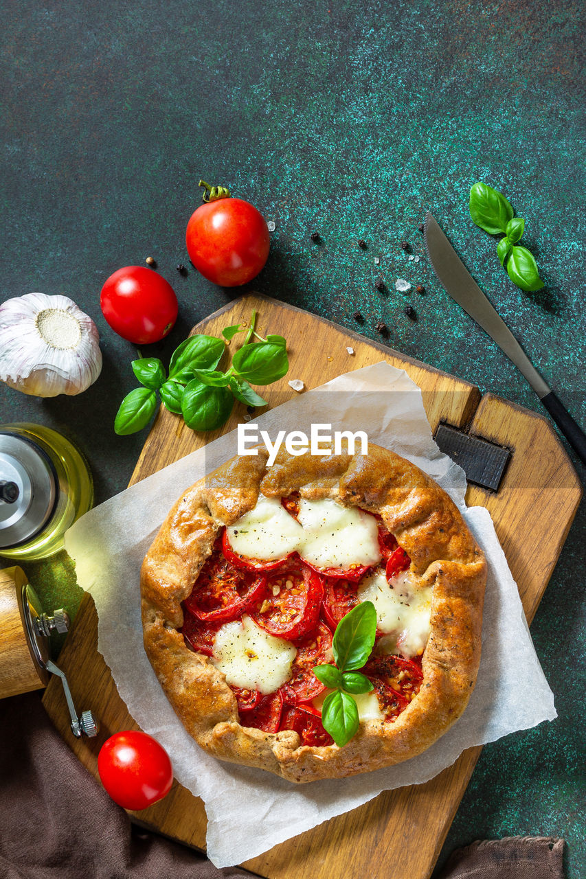 Healthy pastries gluten free, made from rye flour, diet food. galette tomatoes, mozzarella. 