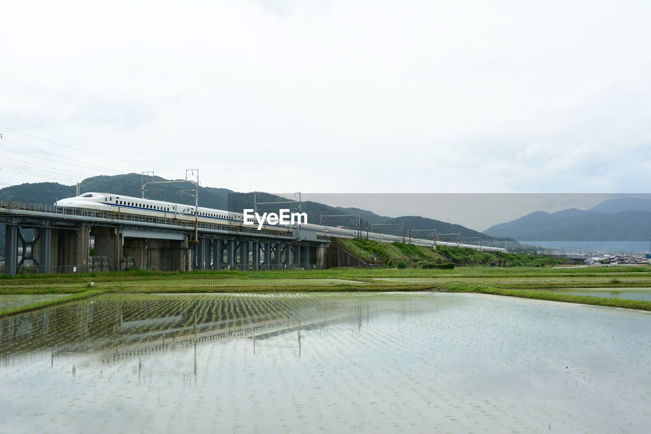 Tokaido shinkansen running against the background of mt. ibuki - maibara - gifuhashima, 2023, may