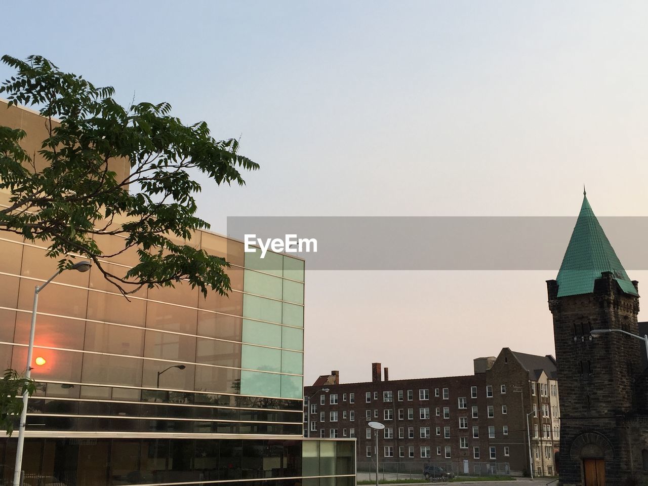 Contrasts architectural features against clear sky