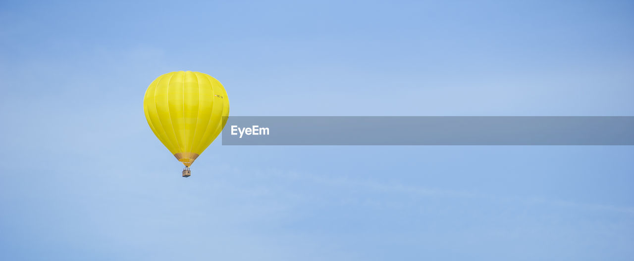 Yellow balloon blue sky