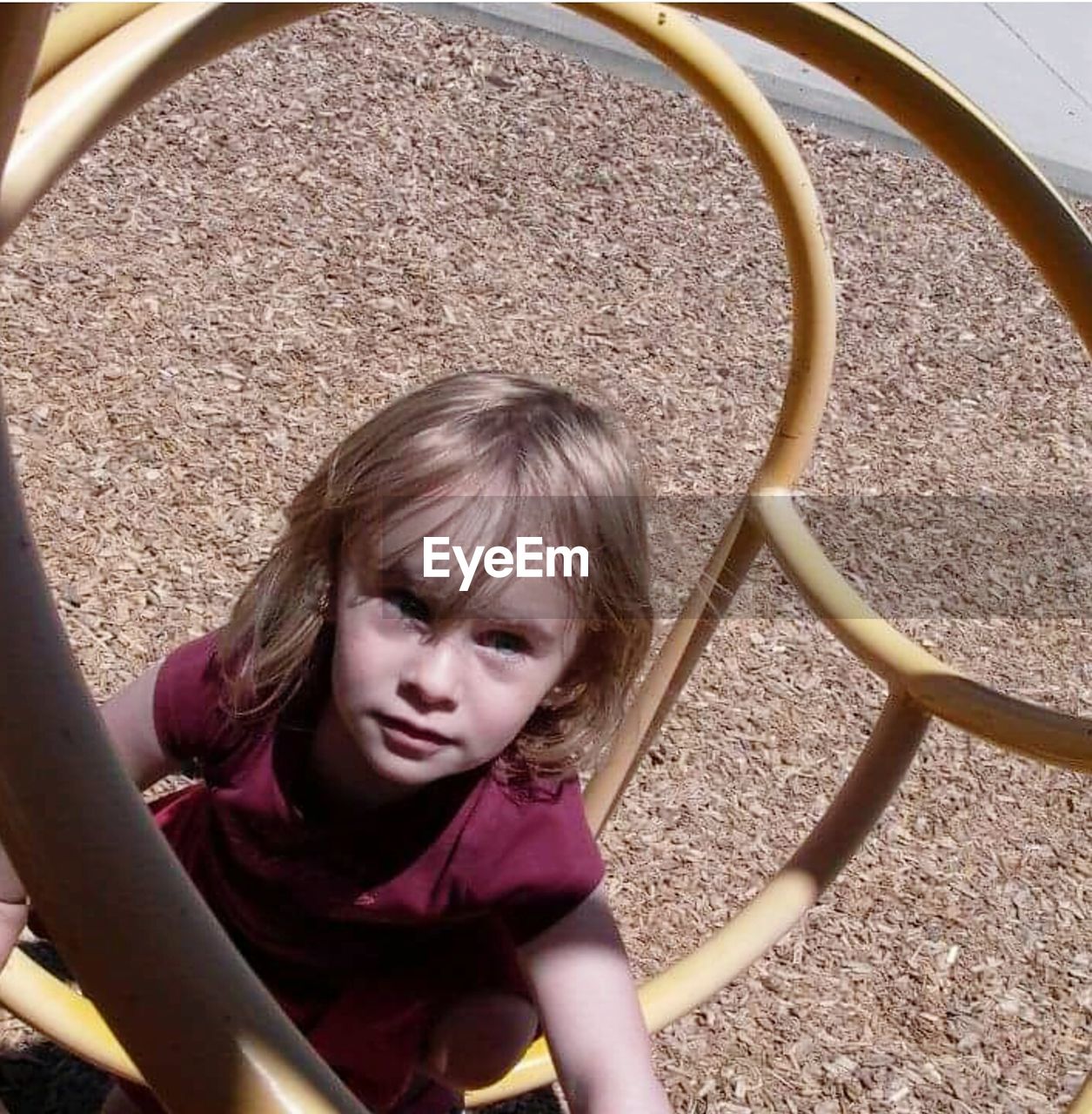 High angle view of girl on play equipment at park