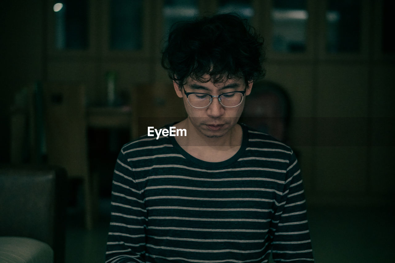 Portrait of young man wearing eyeglasses