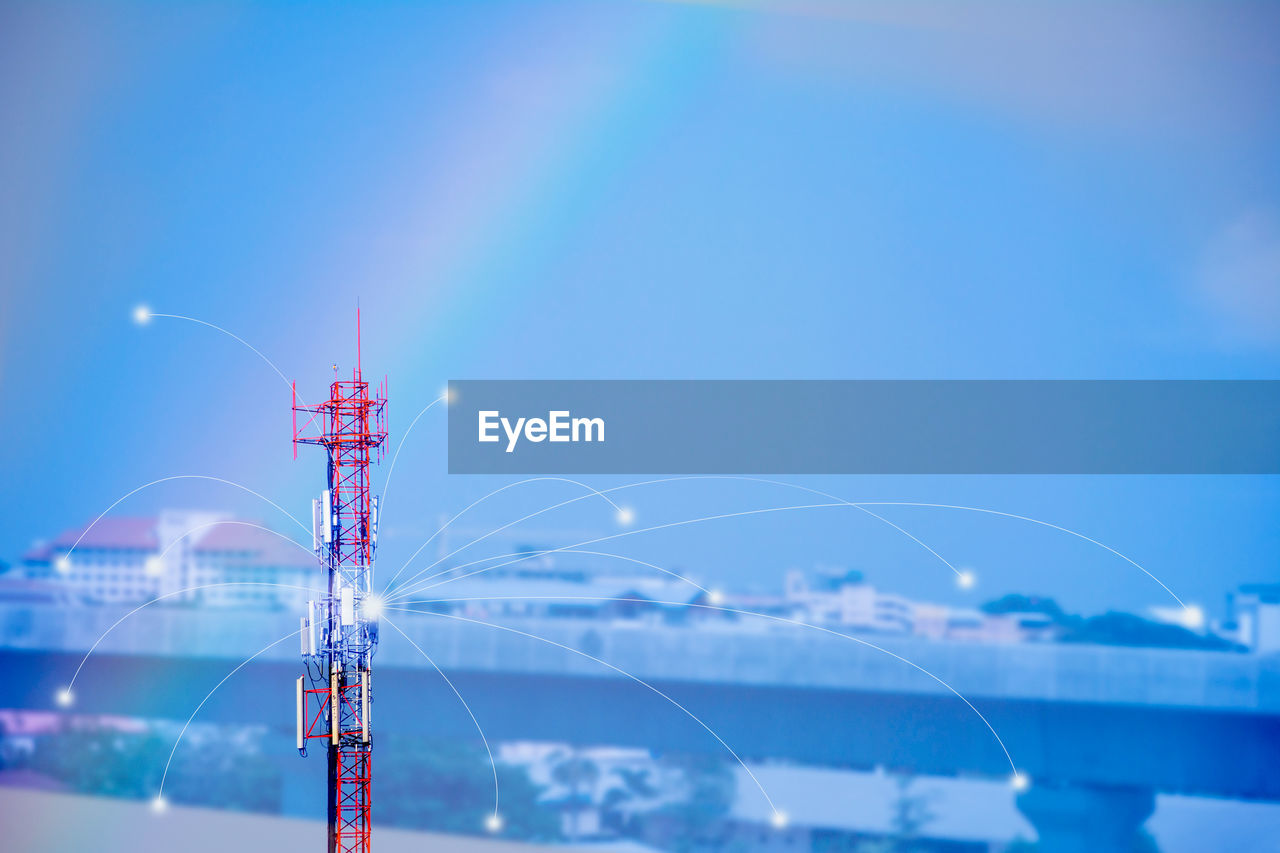 LOW ANGLE VIEW OF ILLUMINATED CRANES AGAINST SKY