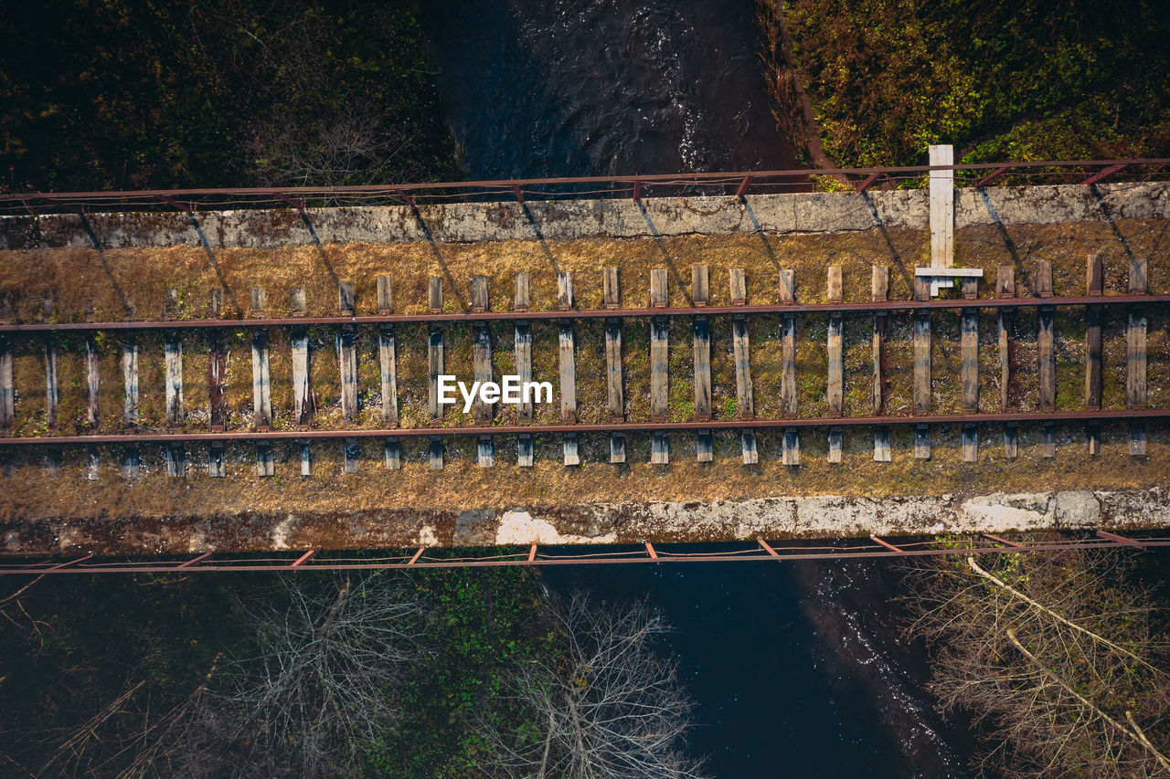 View of bridge over river against mountain