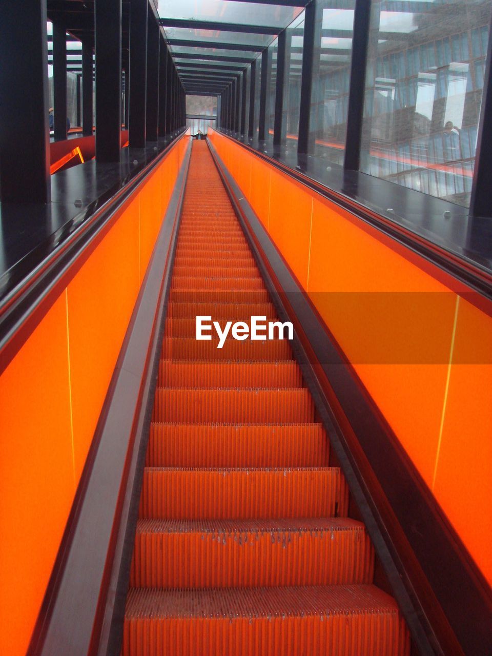 VIEW OF ESCALATOR AT RAILROAD TRACKS