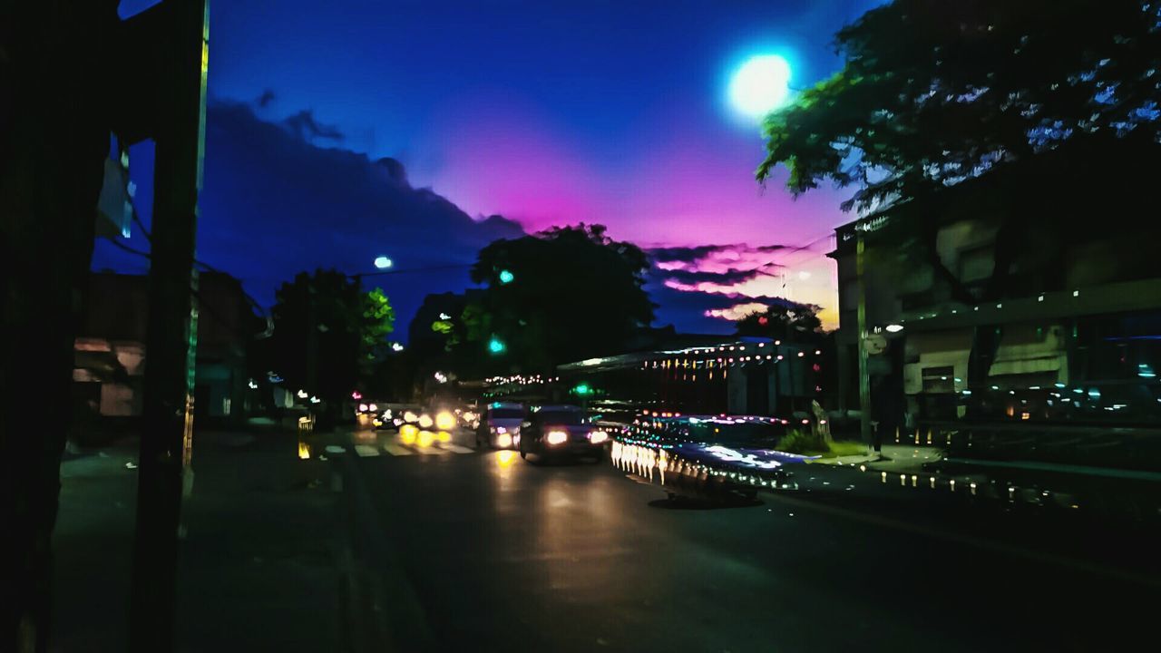 VIEW OF ILLUMINATED STREET LIGHT AT NIGHT
