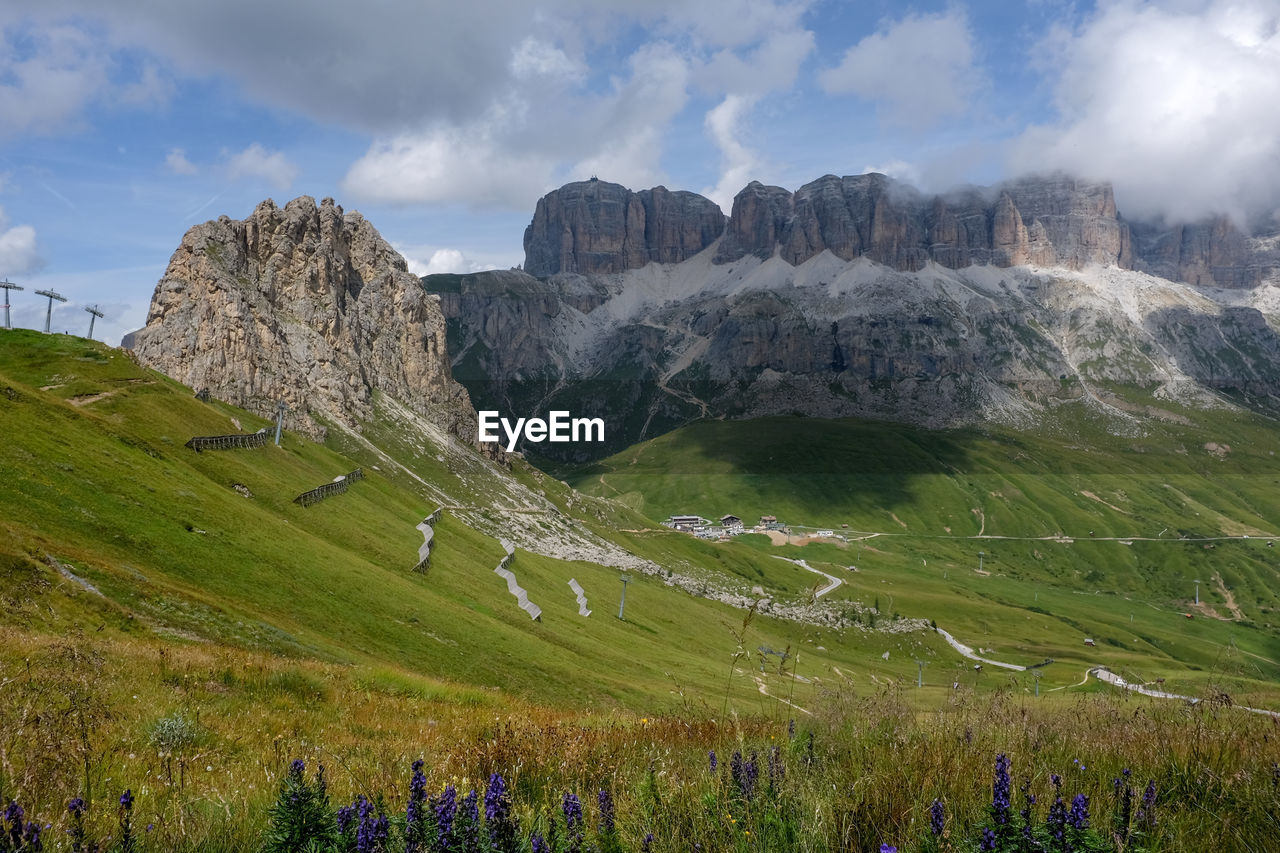 Panoramic view of dolomite landscape against dramatic sky