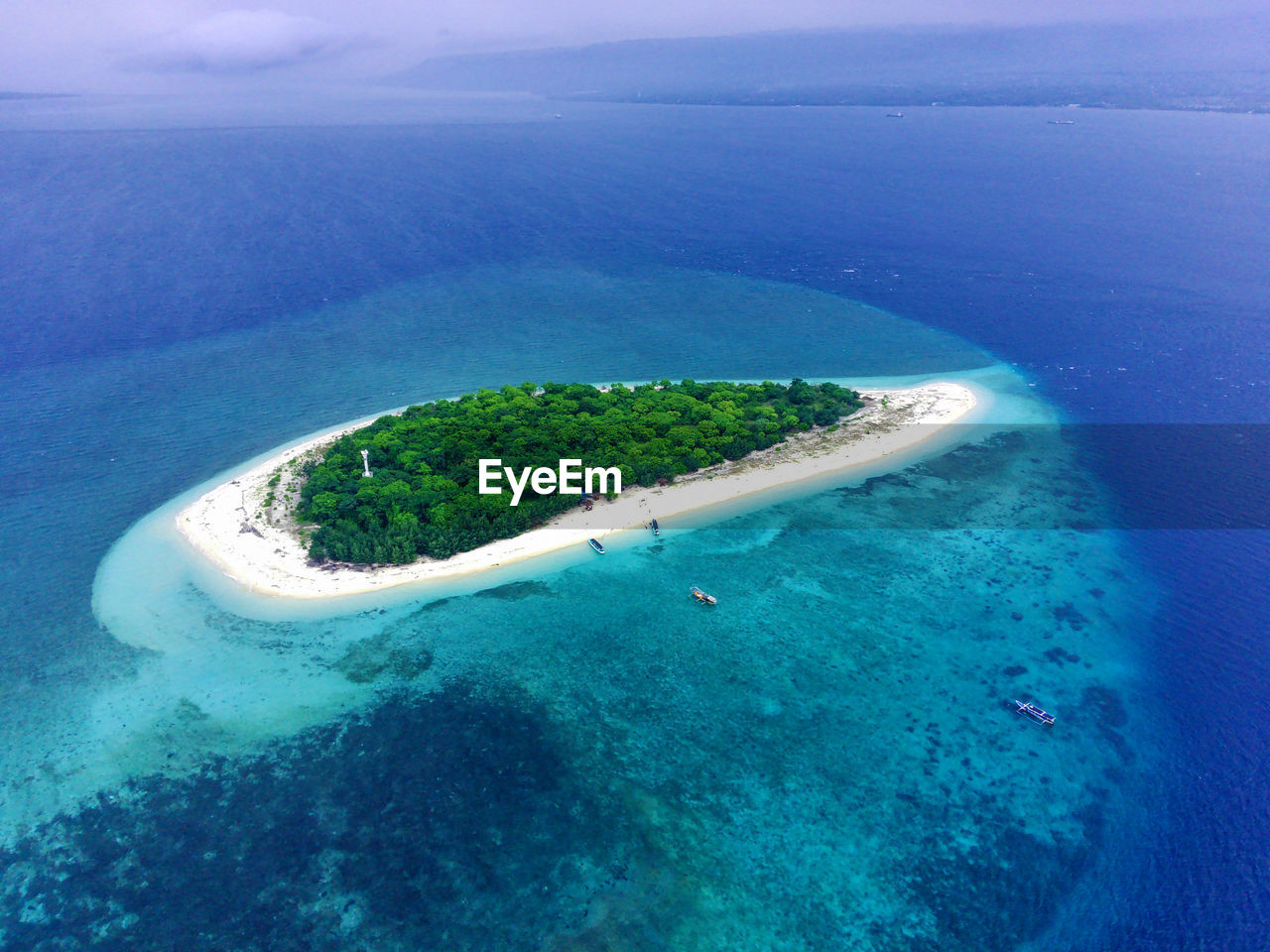 The small island named tabuhan in the beautiful clear waters of the bali straits. banyuwangi.