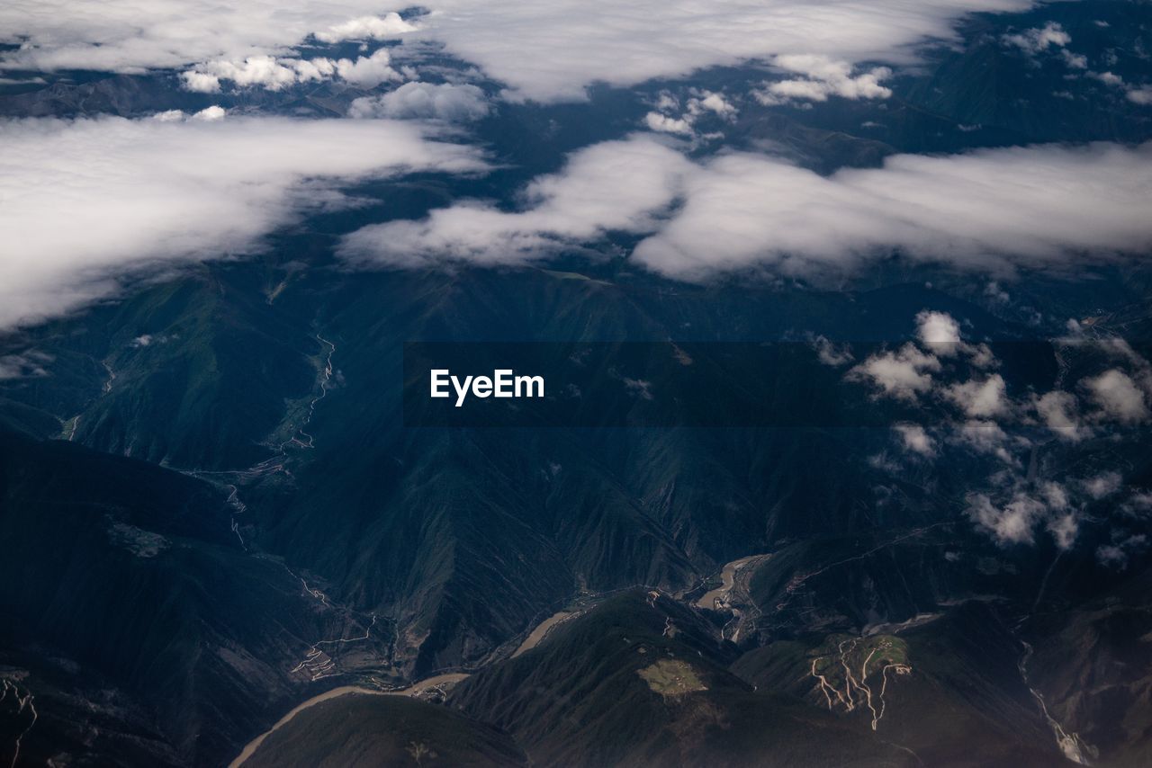 Aerial view of mountains against sky