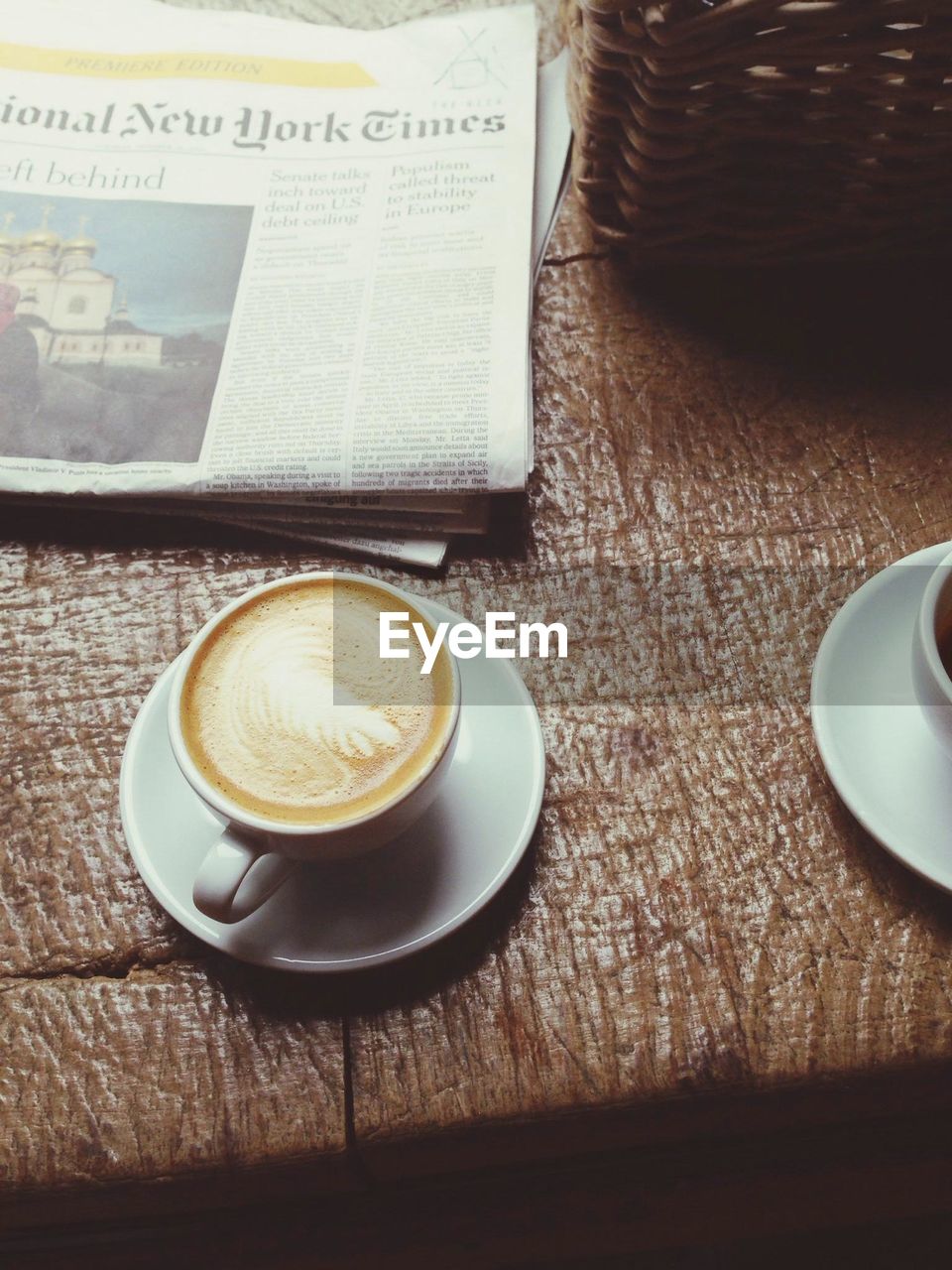 CLOSE-UP OF COFFEE CUP WITH COFFEE CUP