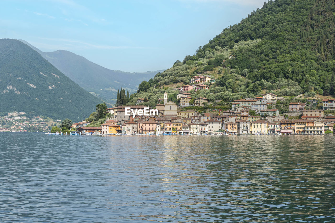 Landscape of the lakeside of peshiera maraglio in monte isola with beautiful colored houses 