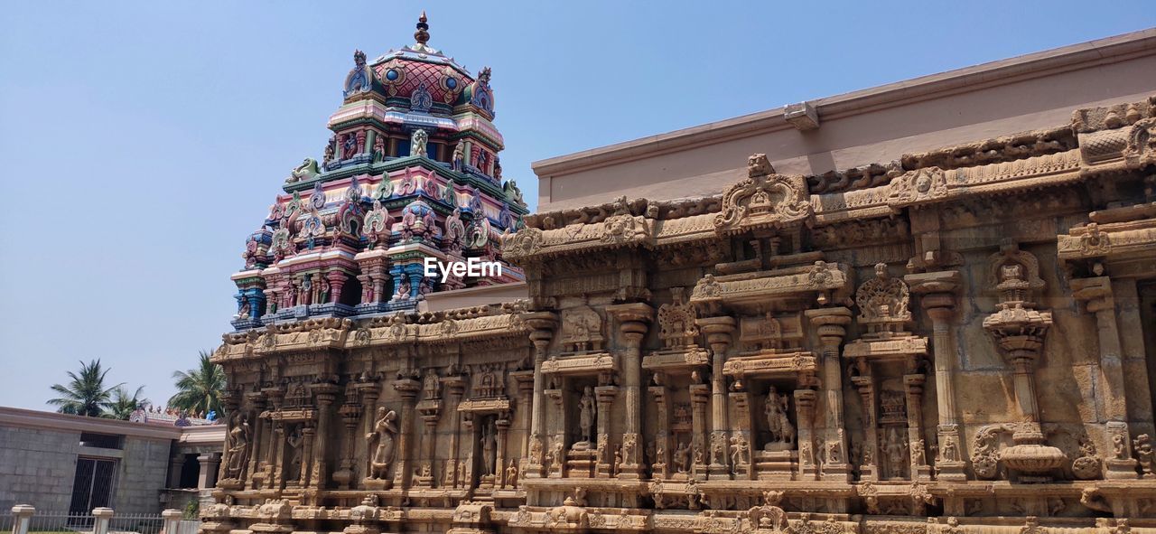 LOW ANGLE VIEW OF CATHEDRAL AGAINST BUILDINGS