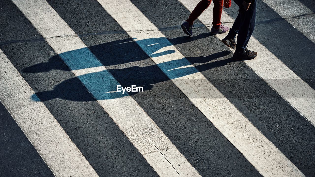 Low section of people crossing the road