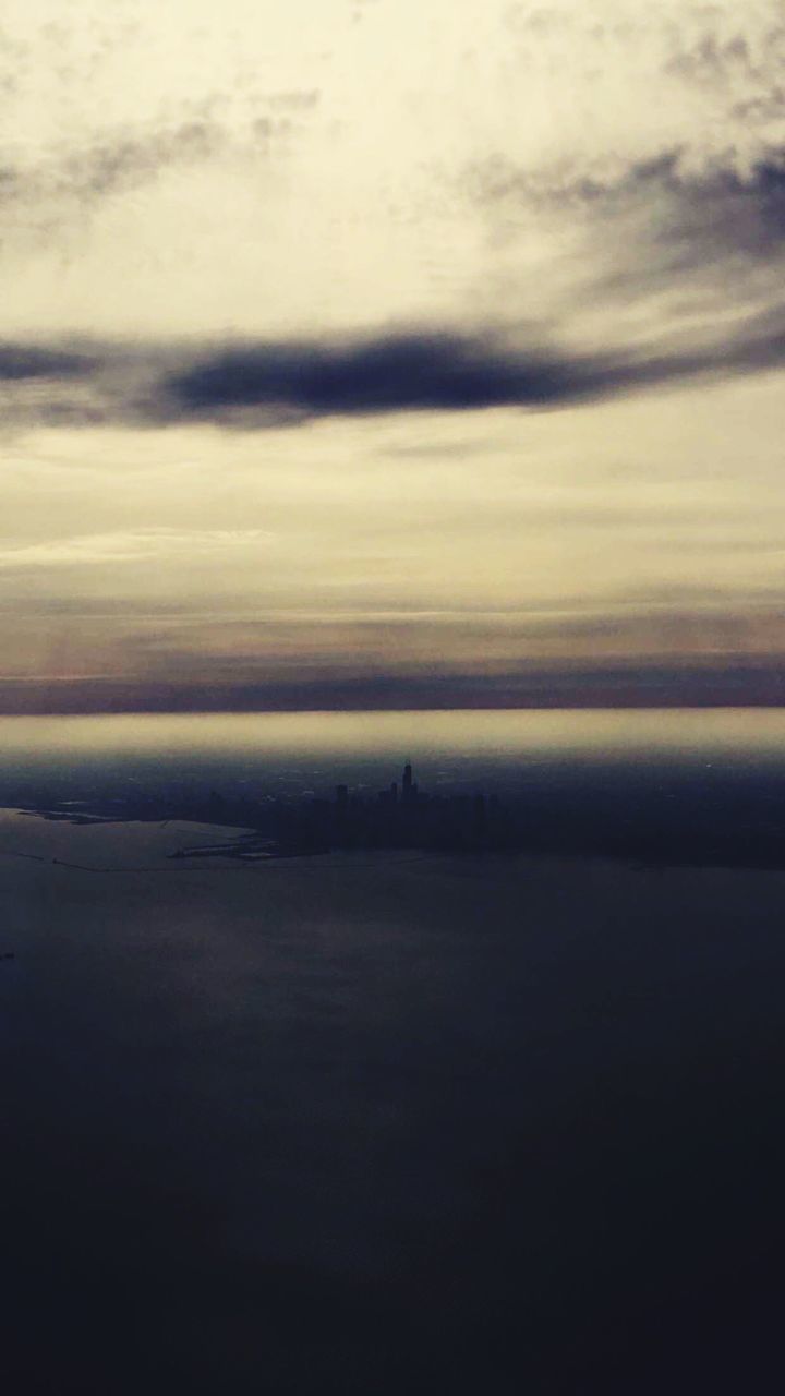 Scenic view of landscape against cloudy sky