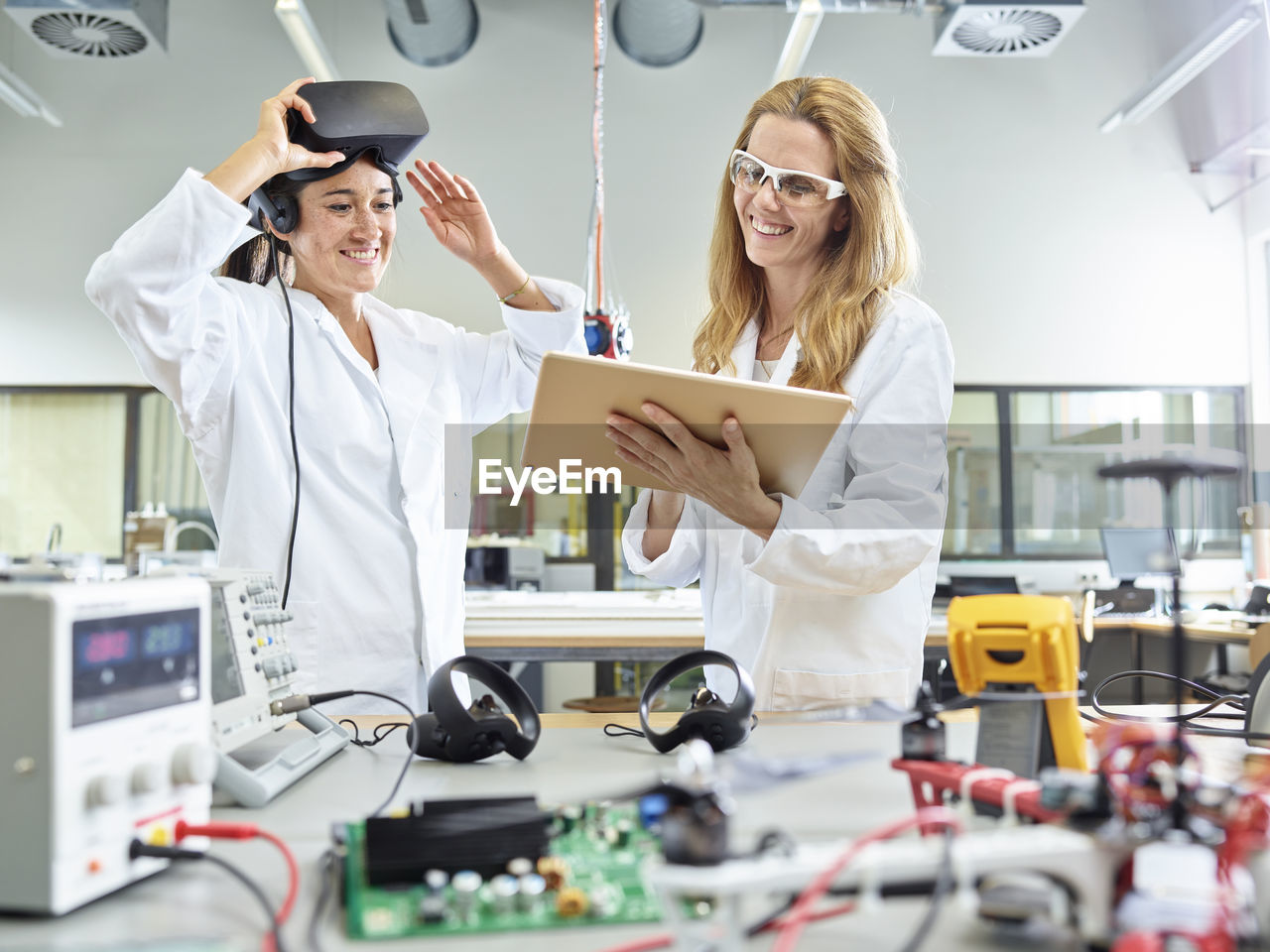 Female technicians working with tablet and vr glasses