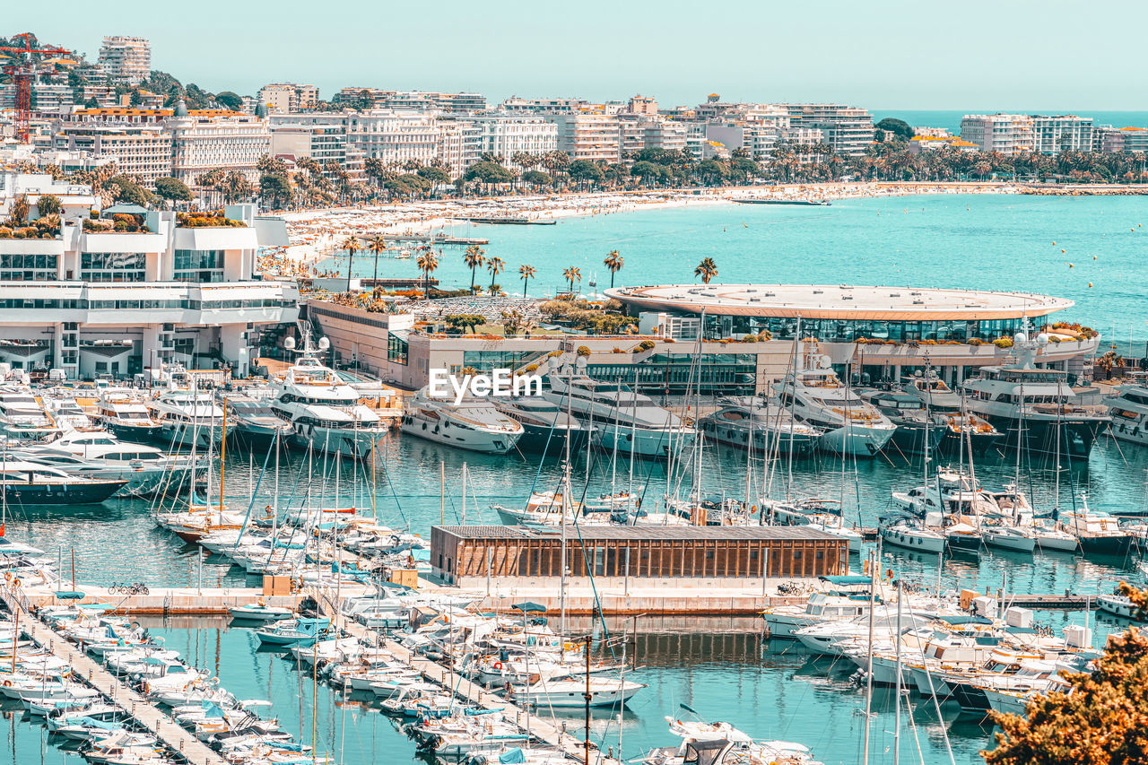 Aerial view of luxurious yachts and boats in cannes harbor port at mediterranean sea