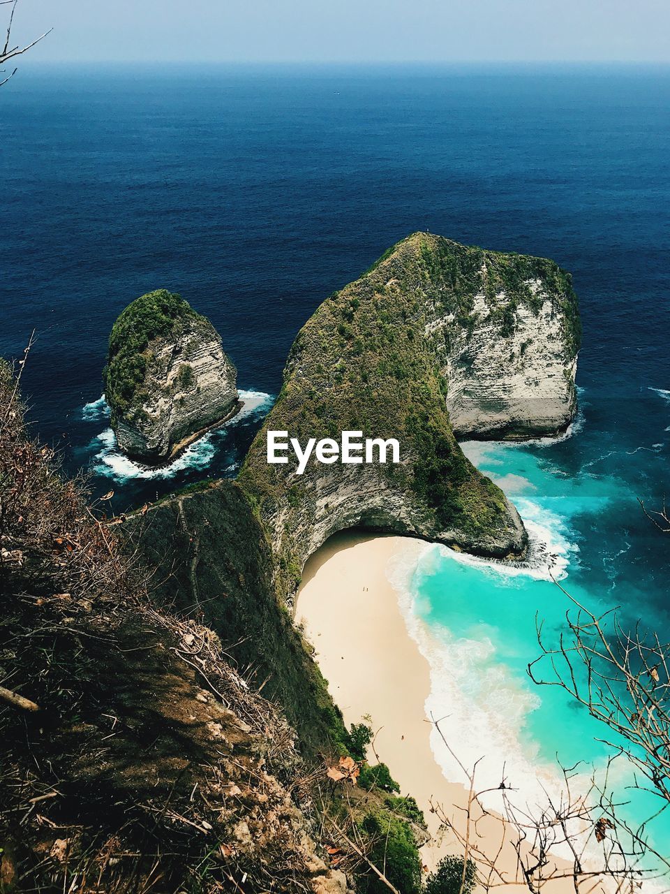 High angle view of rocks by sea against sky