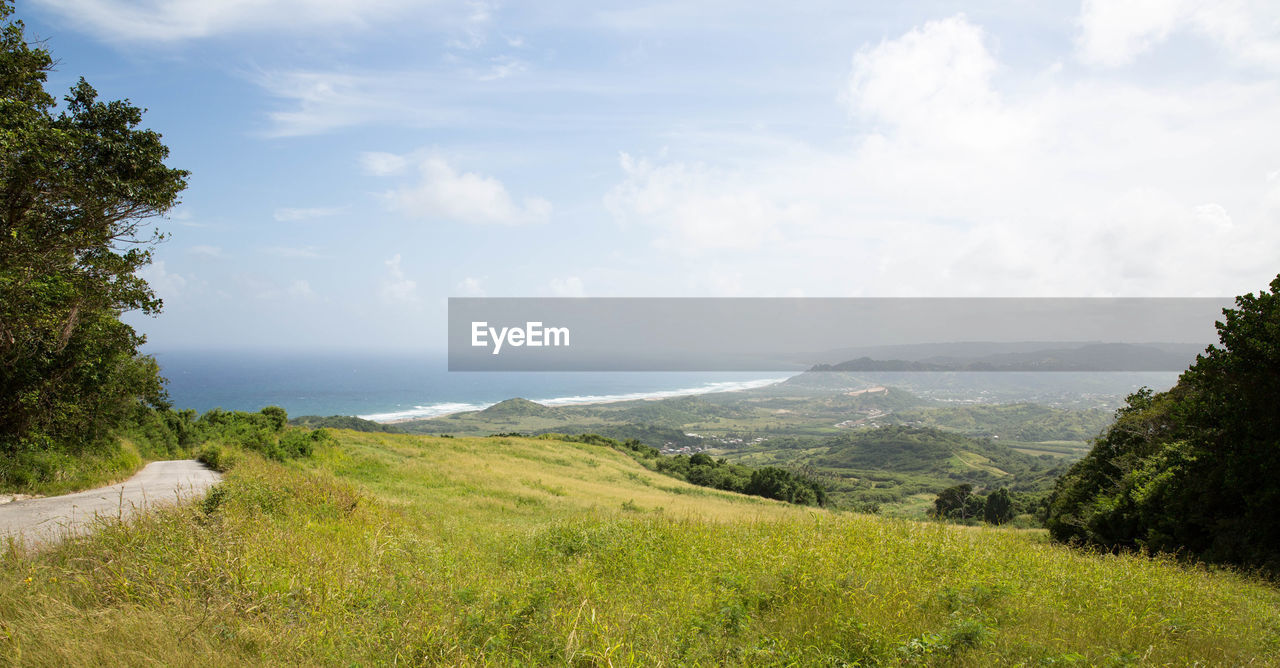 Scenic view of sea against cloudy sky